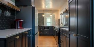 Completely remodeled like new Gingerbread midtown cottage with gleaming hardwoods, converted from a 3/1 to a 3/2. Gallery 17