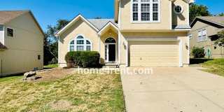Beautiful Home in Blue Valley Schools w/ Wood Floors, Finished Basement and a Peaceful, Private Fenced Yard! Gallery 1