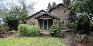 Vintage Urban Farmhouse 3 Bd 1 Bath home! Large bonus room  Balcony! Surrounded by trees on large lot! Gardens  Deck! Gallery 1