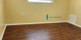 Beautiful 2/2/1 1150 Sq. Ft. with BONUS ROOM!!... tile & luxury plank flooring, Frest paint and a large fenced in yard! Gallery 19