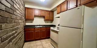 Cozy One Bedroom Apartment! Exposed Brick, Off-Street Parking & More! Call Today! Gallery 1
