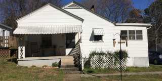 Charming 2-Bedroom, 2-Bath Single-Family Home with Sunroom & Wooded Views Charming 2-Bedroom, 2-Bath Single-Family Home with Sunroom & Wooded Views Gallery 1