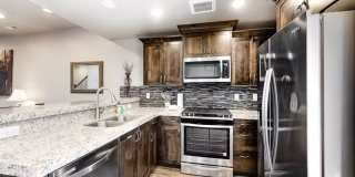 Clean 3 Bedroom Furnished Park's Edge Townhouse with A/C and 2 Car Garage Gallery 1