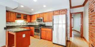 Charming 1-Bedroom Apartment with Exposed Brick, Hardwood Floors & Updated Kitchen Gallery 16