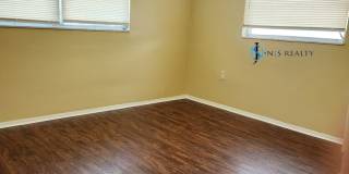 Beautiful 2/2/1 1150 Sq. Ft. with BONUS ROOM!!... tile & luxury plank flooring, Frest paint and a large fenced in yard! Gallery 20