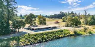 RARE RIVERFRONT HOME WITH LARGE SHOP ON ACREAGE!! Gallery 1