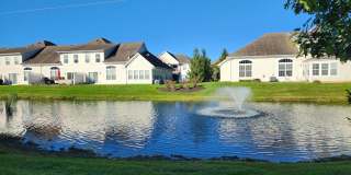 Available Now!3 BR/2.5BA Water View Condo with a 2-Car Garage and Community pool! Gallery 1