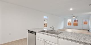 This beautiful single-story home has 4 bedrooms, 2 baths, vinyl flooring throughout, an open floor plan Gallery 7