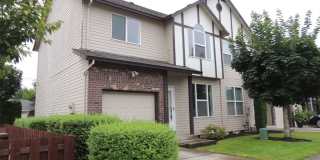MOVE-IN SPECIAL – 1/2 Off First Month’s Rent! Charming 3-Bedroom End-Unit Townhome with Attached Garage & Private Yard! Gallery 1