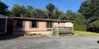 Set on over an acre in Saylorsburg, this 3-bedroom 2 bath Gallery 1
