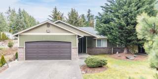 Inviting 3 Bedroom/2 Bathroom Duplex in Puyallup! Two Car Garage, Fenced Yard, Cul-de-Sac, New Plank Flooring! Gallery 1