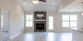 Modern Living Redefined with Stone Fireplace, Gray Cabinetry, Spa Inspired Primary Suite and Covered Outdoor Retreat Gallery 6