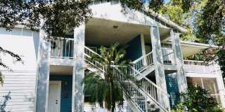 MOVE IN NOW!! NEW LAMINATE PLANK FLOORING & FRESH PAINT! Spacious 2nd floor- 2bd 2ba condo in gated community!! LARGE SCREENED IN BALCONY! Gallery 1