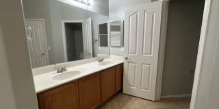 Single-level 3-bedroom home in a desirable Chandler location featuring a 2-car garage and tile roof and wood plank flooring throughout Gallery 25