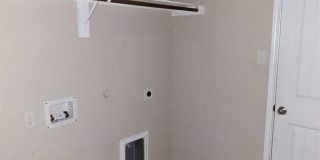 2 car garage with lighting, granite countertops. Backyard includes a custom extended concrete patio perfect for gatherings Gallery 9