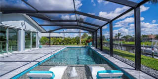 FURNISHED SHORT TERM RENTAL - 3 Bed / 2 Bath - Single Family Pool Home - $5,000/month ** Heated Swimming Pool ** Canal View Gallery 1