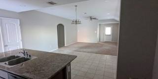 2 car garage with lighting, granite countertops. Backyard includes a custom extended concrete patio perfect for gatherings Gallery 23