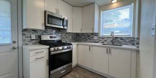 Updated 2BR house with off street parking! Gallery 1