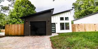 Spacious Fully Furnished 3BR/3BA home in a quiet neighborhood near downtown and beaches, featuring private baths, outdoor seating areas, fenced yard, and modern comforts—perfect for short or long-term stays. Gallery 1