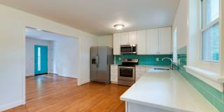 Discover the epitome of stylish living in this meticulously updated mid-century brick ranch, now available for rent. Gallery 11