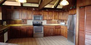 Very private, mostly furnished, rustic Maui Meadows home with large pool, walk around deck with panoramic ocean views. Available for 6 months only. Gallery 12