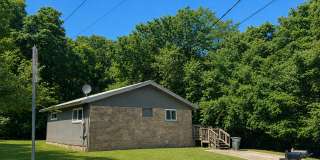 Two Bedroom Cottage Style Home Nestled in the Woods Gallery 1