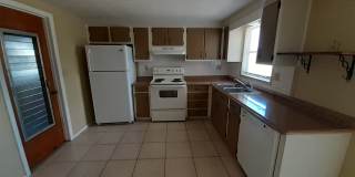 JUST REDUCED!!! 2/1.5/1 1000 Sq. Ft. NEW AC!!!Spacious living room, Lanai, fenced in yard, and tile floors thoughout! Gallery 4