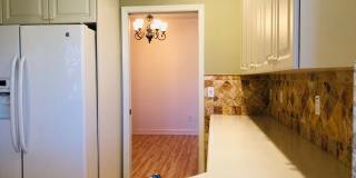 Experience Bell Tower Park. GATED ground floor 2 Bed 2 Bath Den 1 Car Garage Condo. Gallery 36