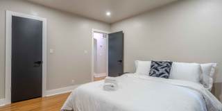Completely remodeled like new Gingerbread midtown cottage with gleaming hardwoods, converted from a 3/1 to a 3/2. Gallery 27