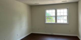 Updated 2 bedroom, 1 bath apartment with walk-out patio off of kitchen, and updated flooring. Gallery 6