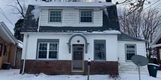 Cozy Akron Home w/ Fireplace Charm, Detached Garage  Back Porch Gallery 1