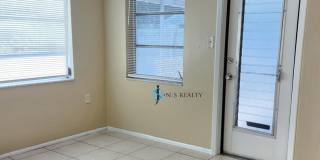 Beautiful 2/2/1 1150 Sq. Ft. with BONUS ROOM!!... tile & luxury plank flooring, Frest paint and a large fenced in yard! Gallery 9