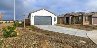 Charming 3-Bedroom Home with Modern Amenities inside a great community in Waddell, AZ Gallery 1