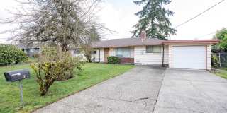 Spacious 4-Bedroom Home with Large Yard, Covered Patio & Garage in Lakewood Gallery 1