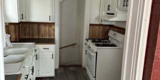 Single Family Home 3 bedroom 1 bath new paint flooring with basement fenced in yard Gallery 10