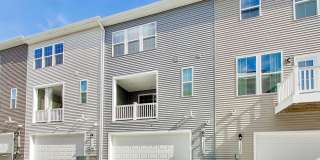 Welcome to this beautifully designed 3 level townhome in Westphalia Town Center Community! Gallery 33