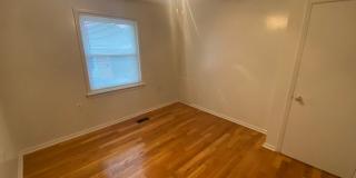 A brick townhouse steps from Lakewood shopping and dining — with everything already in it. Gallery 14