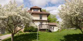 Bright, beautiful home with 3 garage spaces & tons of storage! Gallery 1