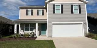 Discover this spacious 4-bedroom, 2.5-bath home in Winnabow, NC Gallery 1