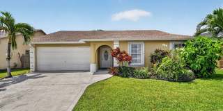 Sophisticated 3BD/2BA Furnished Single-Family Home in the Heart of Greenacres Gated Community Gallery 1
