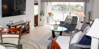 ***BERKSHIRE LAKES***NEW REMODELED MASTER BATH***STUNNING LAKE/BRIDGE VIEW***END UNIT*** Gallery 1