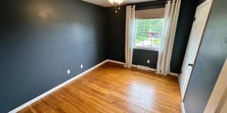 AVAILABLE NOW! Spacious 4 BR, 2 Bath House! Wood Floors, Attached Garage, W/D Included Gallery 10