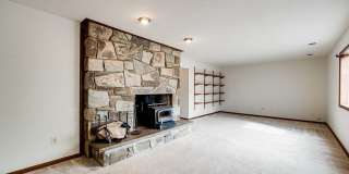Welcome home! One of a kind, strikingly designed 2-level hillside chalet built on 1 1/2 acres of wooded property with stream surrounded by park land. Gallery 25