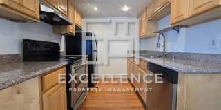 2/1.5 Condo in 4plex, Granite Counters, LVT, 1 Car Garage, Community Pool and Laundry Gallery 1