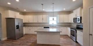 Get ready to fall in love—this sleek, modern beauty in West Creek Farms is bringing the wow factor to Clarksville! Gallery 7