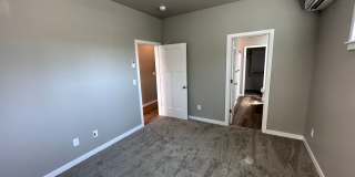 4 Bedroom / 4 bath New Townhome. Every bedroom is its own Master Suite with your own full bathroom, walk in closet and A/C unit. Full-size washer and dryer in your unit. Gallery 33