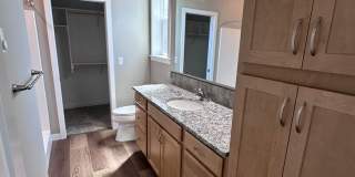 4 Bedroom / 4 bath New Townhome. Every bedroom is its own Master Suite with your own full bathroom, walk in closet and A/C unit. Full-size washer and dryer in your unit. Gallery 34