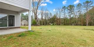 Rare 2023-built home on an oversized 0.35-acre lot in one of Waxhaw's most sought-after communities — zoned for the 9/10-rated Waxhaw Elementary School and move-in ready today. Gallery 10