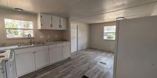 Beautifully renovated 3 bedroom, 1.5 bath home on a spacious .65-acre lot with a fenced backyard and white vinyl privacy fencing. Gallery 1