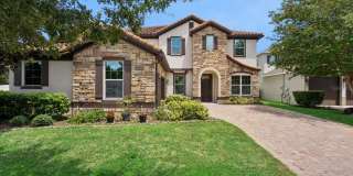 This spacious and charming 7-bedroom, 4.5-bathroom single-family home is located at 8701 Iron Mountain Trail Windermere, Florida 34786 This spacious and charming 7-bedroom, 4.5-bathroom single-family home is located at 8701 Iron Mountain Trail Windermere, Florida 34786 Gallery 1